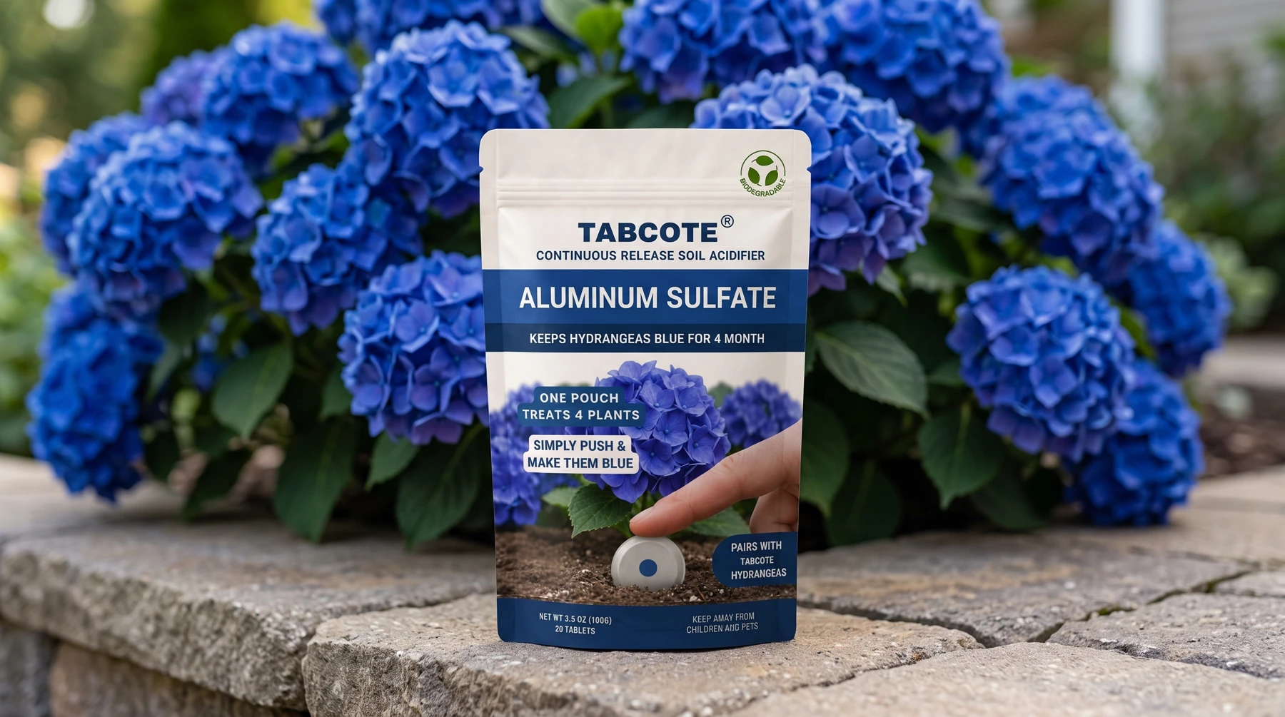 TABCOTE alum pouch in a garden setting